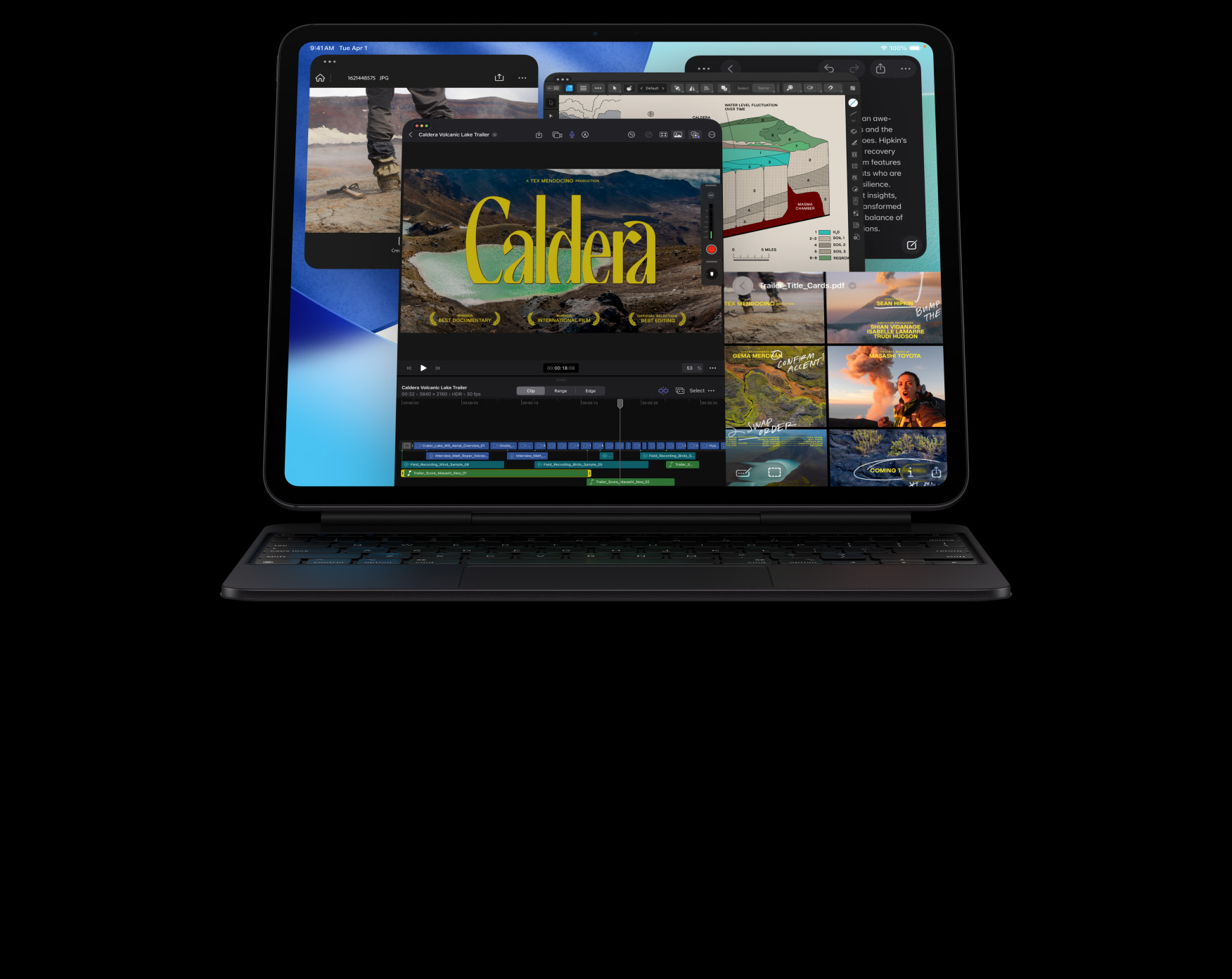 iPad Pro, pohled zepředu, orientace na šířku, vesmírně černá barva, připnutý k vesmírně černému Magic Keyboardu, displej s okny různých aplikací: Final Cut Pro s časovou osou a různými funkcemi na úpravy videa, Mapy, Poznámky, mediální klipy