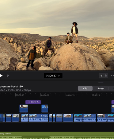App de montage vidéo avec l’image de personnes posant sur des rochers dans un paysage rocheux désertique, timeline, outils de montage